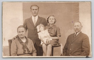 Real Photo Postcard c1925 Family in Studio Girl Holding Antique Doll RPPC