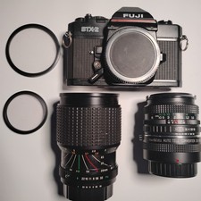 Fuji STX2 35mm SLR Camera VTG PARTS LOT cracked Body, Two Lenses, 2X Magnifier