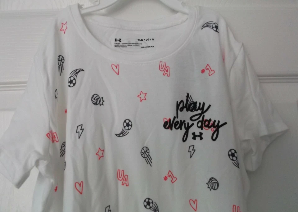 CAMISETA UNDER ARMOUR NIÑA BLANCA - HEATGEAR - GRANDE-YLG/G - NUEVA CON DEFECTO Foto 2 de 4
