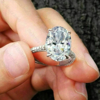 4.0 TCW Oval Cut Moissanite Hidden Halo Engagement Ring In 14k White Gold Plated