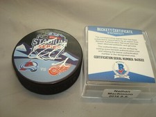 Nathan MacKinnon Signed Avalanche 2016 Stadium Series Hockey Puck Beckett COA 