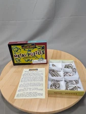 Retro Range Toys and Games Metal Puzzles Set of 6 in box.