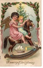 ANTIQUE EMBOSSED CHRISTMAS Postcard     ANGEL AND CHILD RIDING ROCKING HORSE