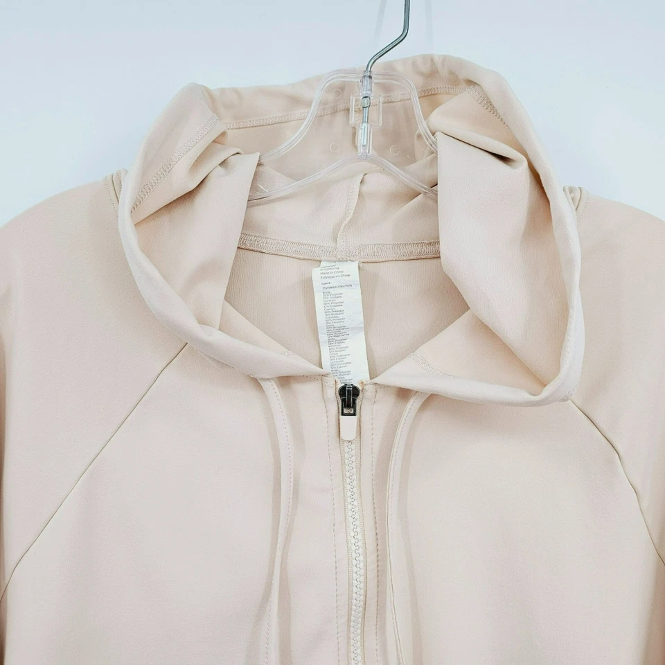 Sudadera con Capucha Recortada Fabletics Oasis 1X Manga Raglán Arena Cremallera Completa Bolsillos Cuadrados Plus Foto 4 de 4