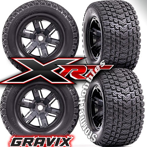 4 Traxxas XRT Gravix Tires & wheels, assembled, glued 7.4" tall 4" wide