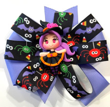 Beautiful Halloween Clay Witch inspired hair bow for girls.