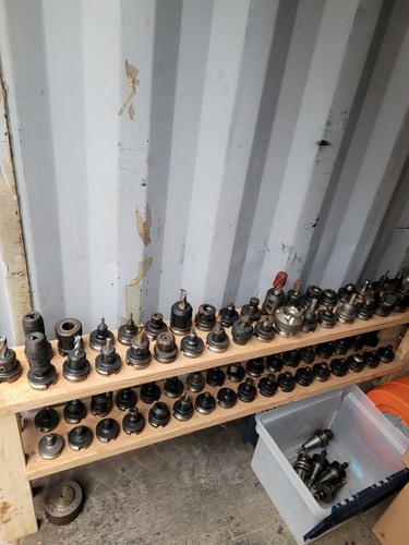 LOT 75 BT-40 CNC TOOL HOLDERS WITH TOOLING END MILLS FACE MILLS CHUCKS COLLETS