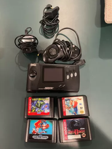Sega Nomad genesis.  Works well.  Includes some games and power cables. 