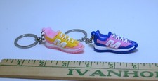 Lot of two sneaker / tennis shoe key chains great collectible set hard to find.