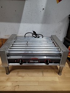 Dog RollersNemco 8027 Hot Dog Roller Grill - 27 Hot Dog Capacity (120V)
