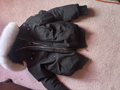 Moose Knuckles women s black fur-trim hooded zip mid-length parka coat logo