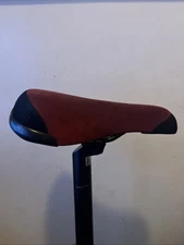 Red mafia bike seat has a little hole