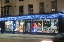 Photo 6x4 Xmas Decorations on Metcalf's hardware store Tring High Street  c2015