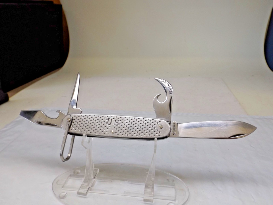 A genuine 1960 Camillus U.S. Military utility demo knife — the kind issued to American servicemen, complete with 4 tools and documented military provenance.