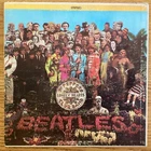 The Beatles “Sgt. Pepper's Lonely Hearts Club Band" 33 1/3 rpm LP record