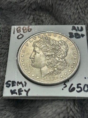 AU++/UNC Semi-KEY 1886-O MORGAN DOLLAR Full Breast feathers. Strong strike