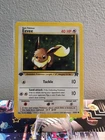 Eevee 55/82 Common 1st Edition Team Rocket Pokémon Card NM/LP