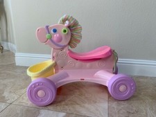 fisher price roll along musical pony