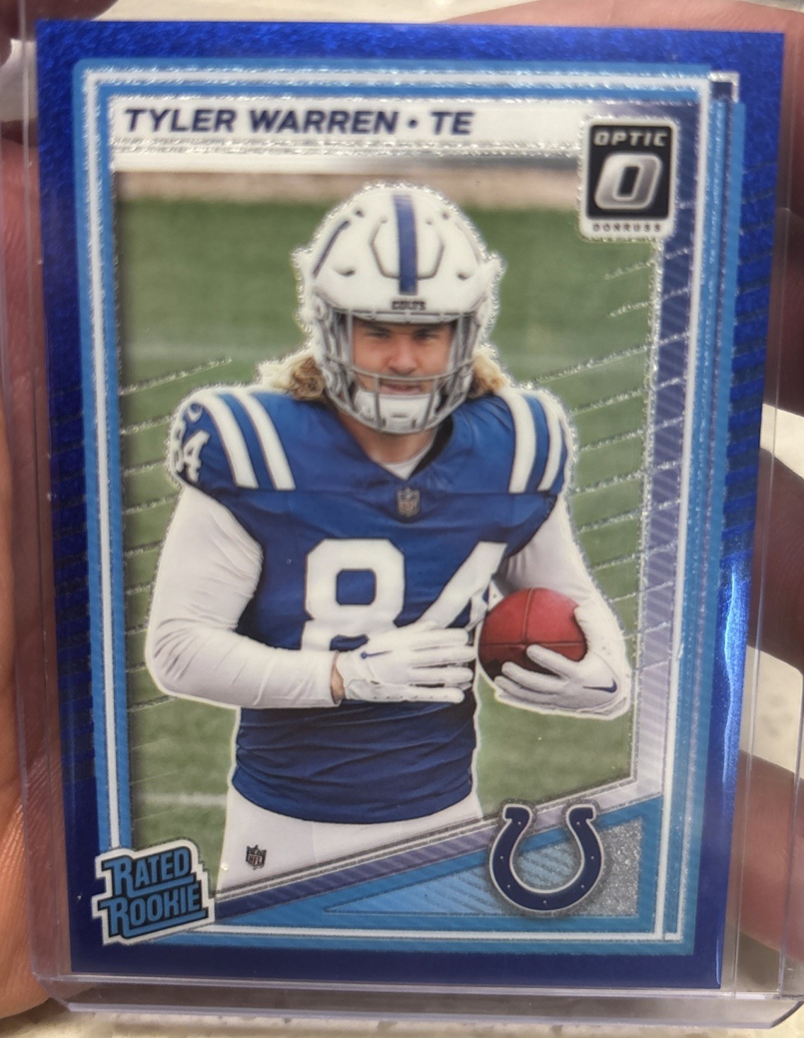 2025 Panini Donruss Optic Tyler Warren Rated Rookie Blue Glitter Prizm #234