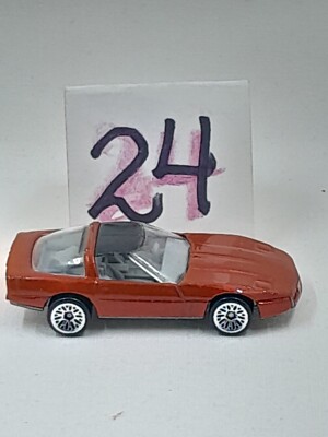 Hot Wheels metallic red '80s Corvette 1982 Corvette w/ gray bag.  1:64. Diecast.