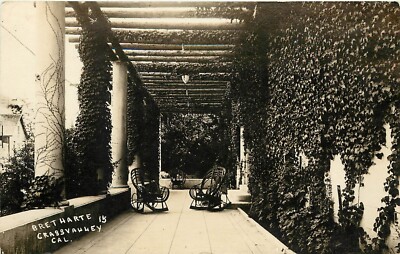 RPPC Postcard Bret Harte Colonnade, Grass Valley CA Rustic Twig Rocking Chairs