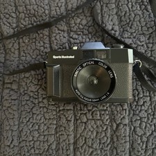 1980s Sports Illustrated Black 50mm Kinetic Optical Auto Focus Film Camera