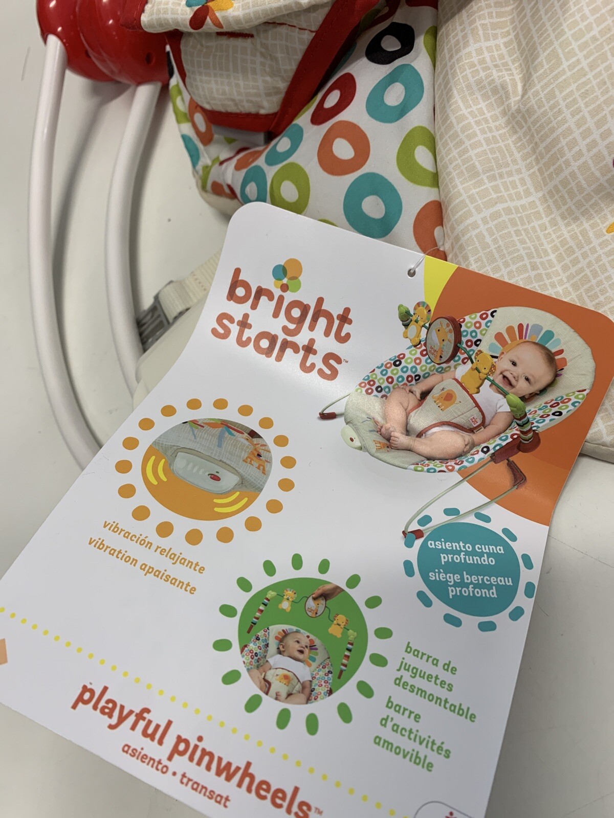 bright starts playful pinwheels bouncer