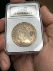 1883 O Morgan Silver Dollar - NGC - MS 63 Toned