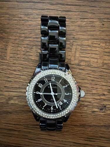 Chanel J12 watch in black ceramic with a diamond-set bezel