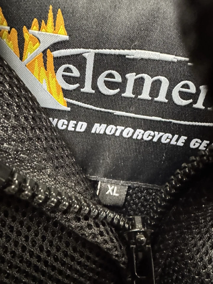 Chaqueta de motociclista Xelement unisex negra blindada forrada acolchada textil talla XL Foto 2 de 4