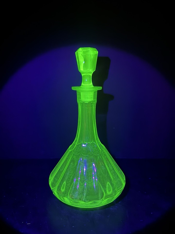 Uranium glass that actually GLOWS under UV light — this rib-optic Art Deco decanter is part science experiment, part 1930s glamour.