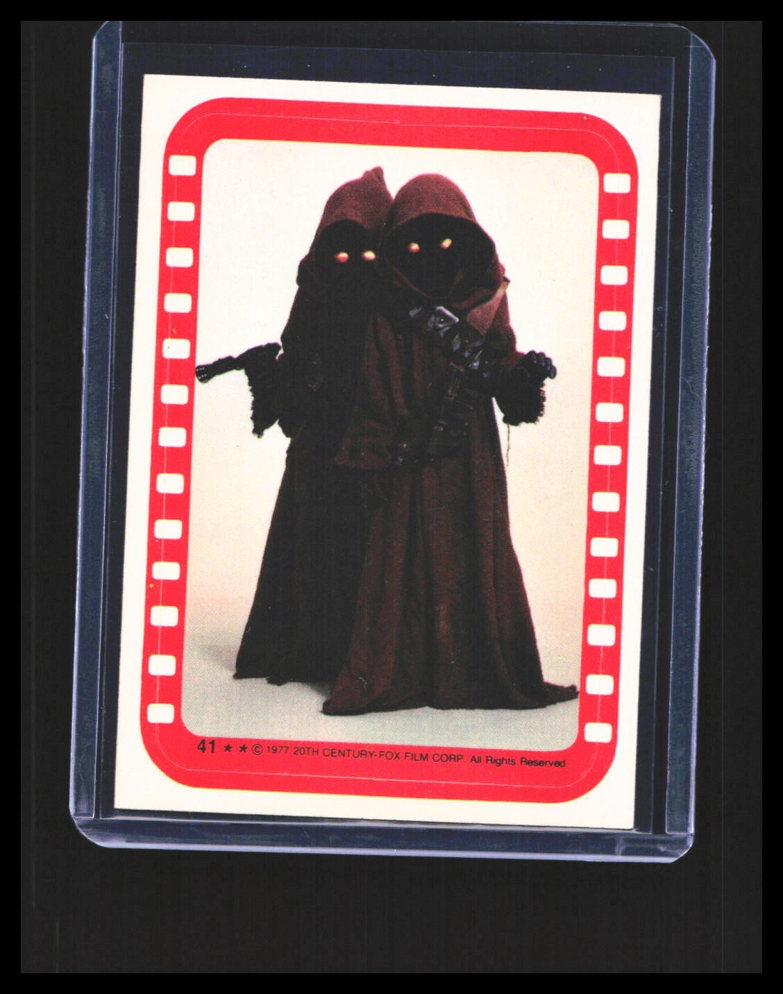 A pair of Jawas #41 Star Wars 1977 Topps Stickers trading card — raw and PSA graded price guide