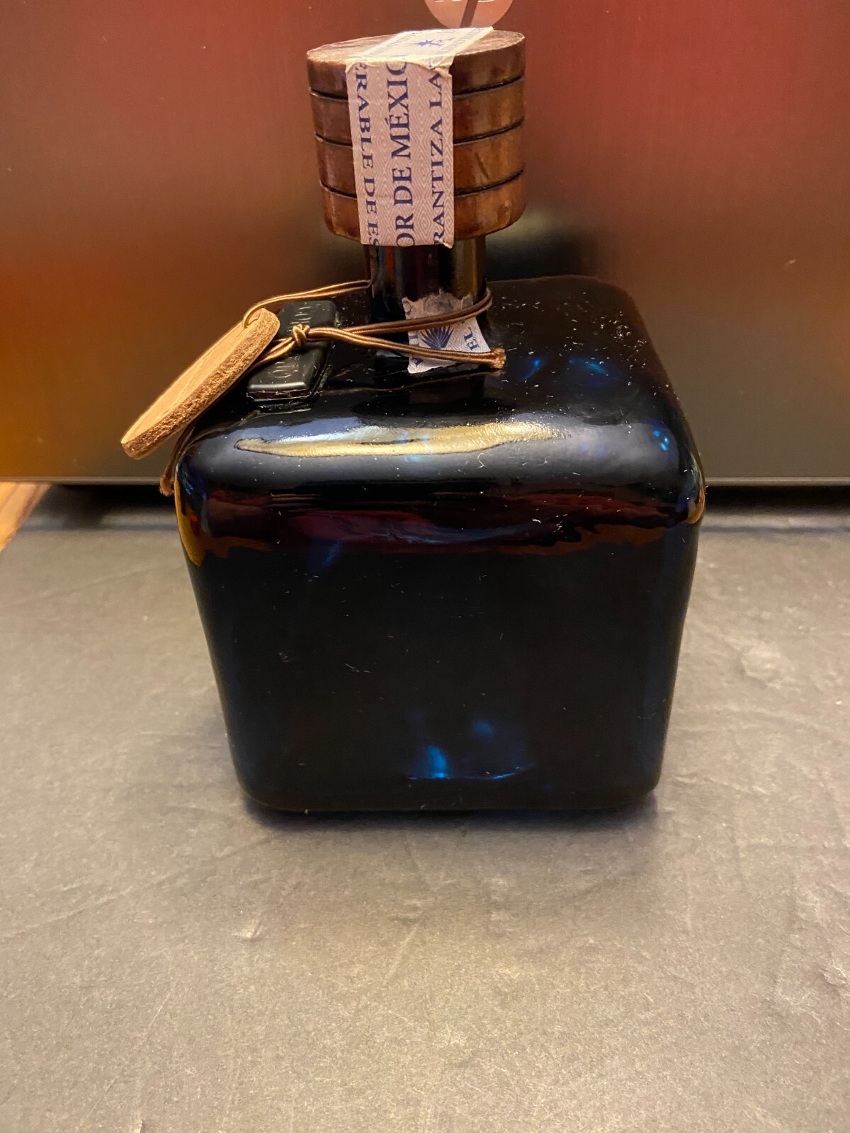 Los Arango special edition cobalt blue leather label tequila bottle