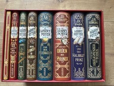 Harry Potter 1-7 im Schuber mit Pappaufstelle...