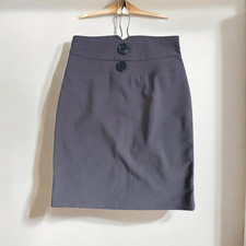 Classic high-waist pencil skirt with decorative front buttons.