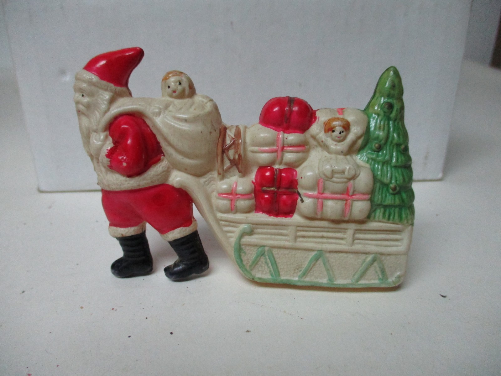 Vintage Celluloid Christmas Santa Claus Pulls Sleigh of Toys & Tree