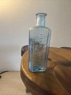 aqua glass medicine bottle from Marten's Chemist on Lime Street Liverpool
