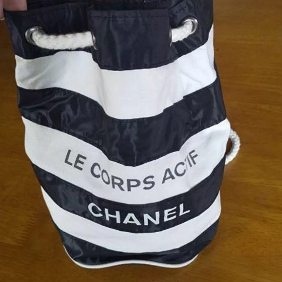 Authentic CHANEL Logos Drawstring Shoulder Bag Canvas Vinyl White