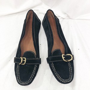black flat shoes with gold buckle