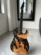 mahogany electric guitar body is surface with an epoxy resin luster neck A set