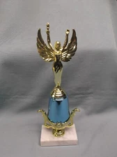 female victory trophy award holding a torch blue riser gold trim beauty pageant