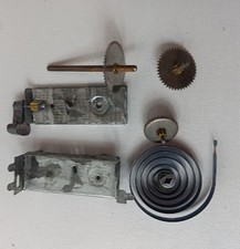 ORIGINAL Tin toy windup motor parts. Spring, gears and housing.