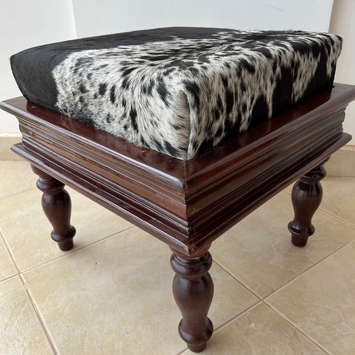Black cowhide ottoman outlet