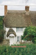 PHOTO  HEWOOD: NARROW COTTAGE A NARROW END-OF-TERRACE THATCHED COTTAGE IN THIS T