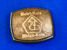 Nutri-Note Rhizo Kote Farming leather belt buckle by El Cip - promotional add