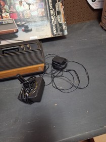 Atari 2600 Video Game Console With 2 Controllers,  Catalog & Damaged Box