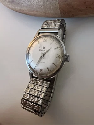 Montre Vintage LIP Dauphine Mécanique - Cadran Blanc, Boîtier Acier, Bracelet Cuir - Années 60/70