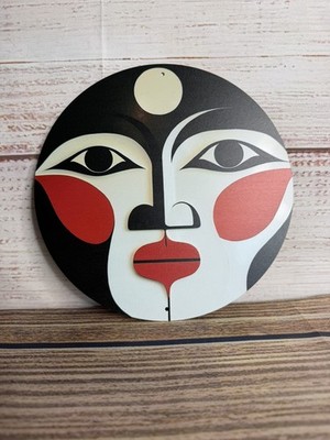 Wandrelief aus Metall mit abstraktem Gesicht - modernes minimalistisches Portraitschild