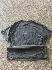 Grey and blue graphic tee with a unique, worn...