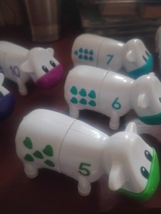Set of 10 Numbered Cow Toys with Colored Shapes for Counting and Learning